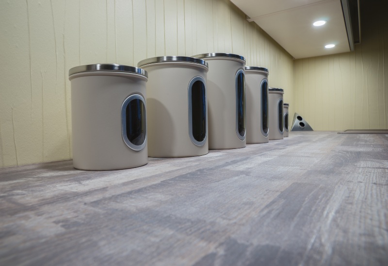 Radioactive material Storage containers on a wood grain counter in a modern setting